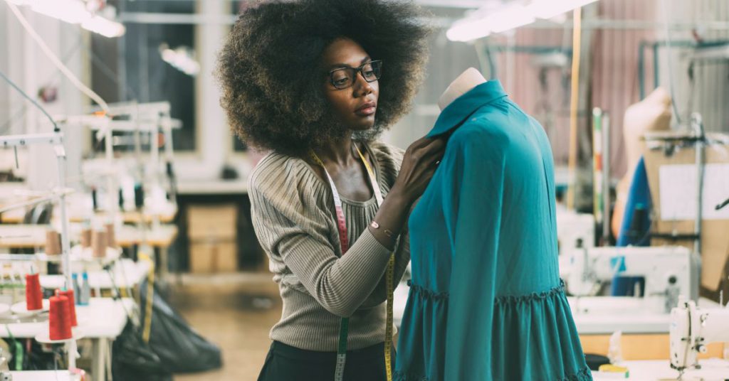 fashion designer making a dress